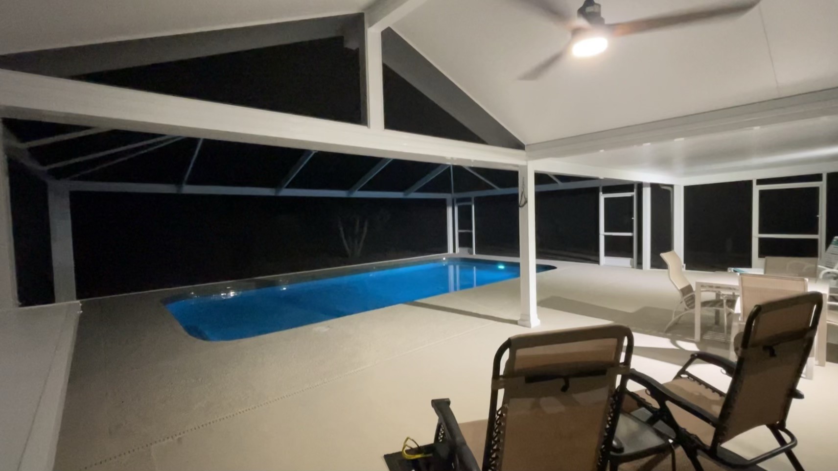 Interior night view of hard cover and pool cage