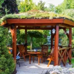 Custom wood gazebo with living roof and paved patio, ideal for outdoor dining and entertaining installed by All Star Sunrooms.