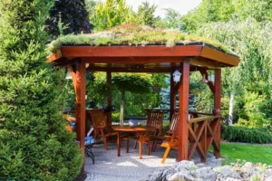 Custom wood gazebo with living roof and paved patio, ideal for outdoor dining and entertaining installed by All Star Sunrooms.