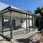 Solid roof patio cover installation for a Florida home in the Treasure Coast