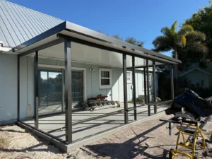 Solid roof patio cover installation for a Florida home in the Treasure Coast