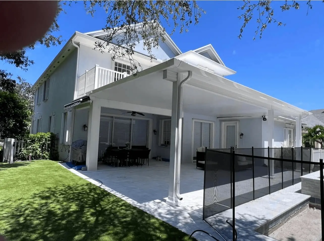 Custom patio enclosure design balancing home architecture with All Star Sunrooms