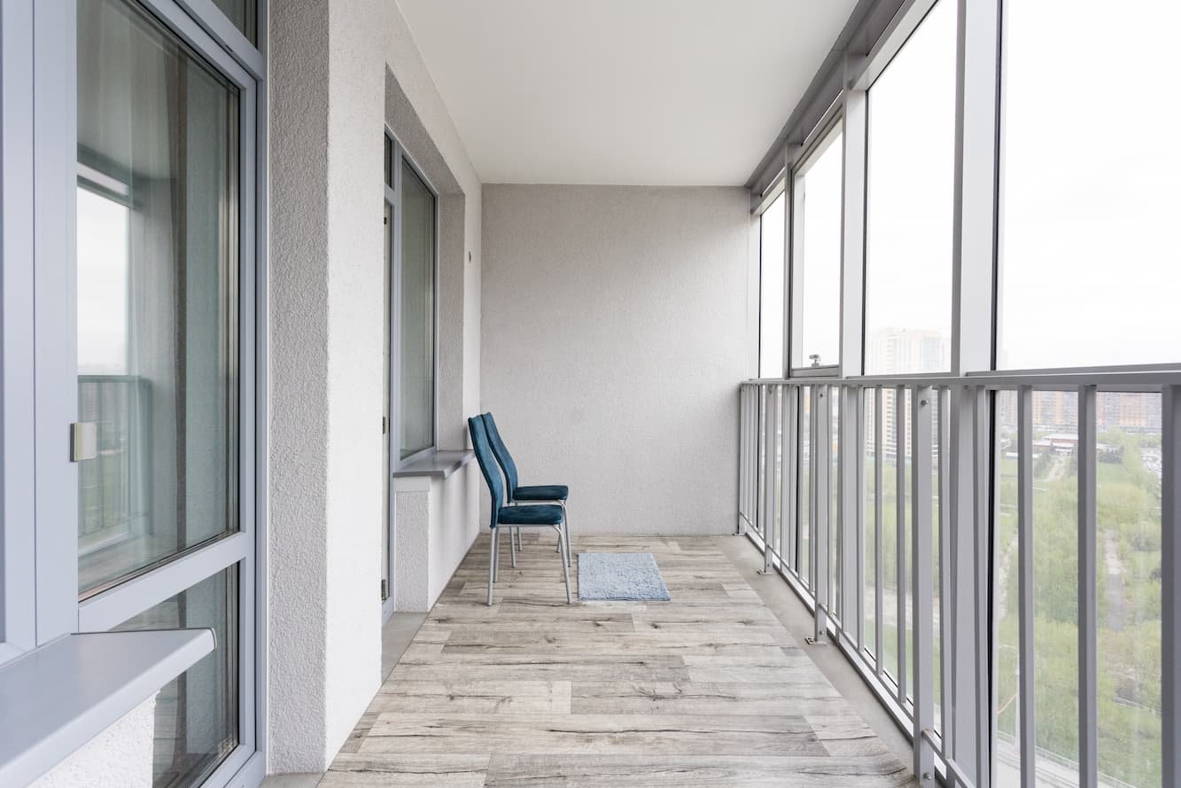 All Star Sunrooms factory-trained installers on a condo balcony screen enclosure project